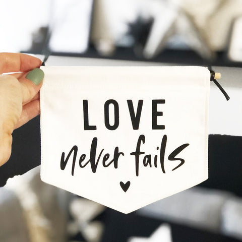 Love Never Fails Fabric Banner